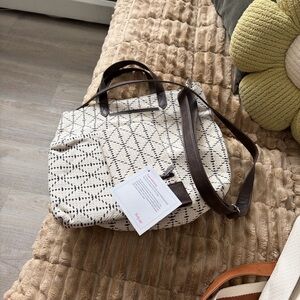 Elegant Patterned Tote Bag with Dark Brown Accents